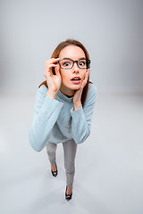 Image showing The young business woman on gray background