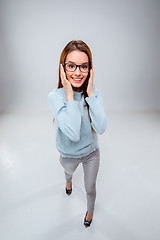 Image showing The smiling young business woman on gray background