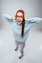 Image showing The smiling young business woman on gray background