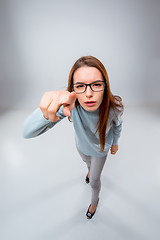 Image showing The young business woman on gray background