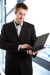 Image showing Businessman with laptop