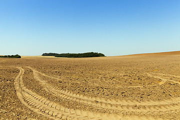 Image showing Wheel tracks on the field