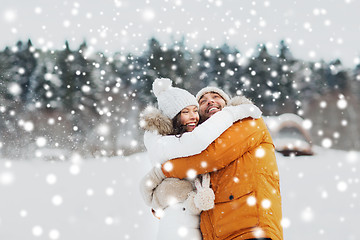 Image showing happy couple hugging and laughing in winter