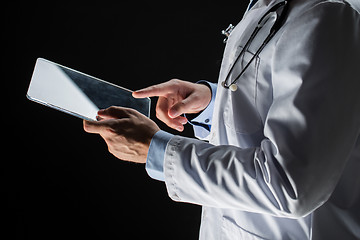 Image showing close up of doctor with tablet pc and stethoscope