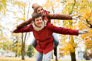 Image showing happy young couple having fun in autumn park