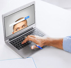 Image showing businessman with laptop computer working at office