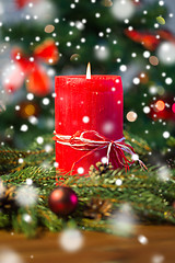 Image showing fir branch wreath with candle on wooden table