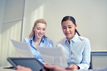 Image showing smiling businesswomen meeting in office