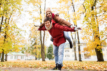 Image showing happy young couple having fun in autumn park