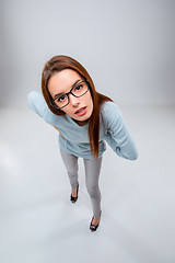 Image showing The young business woman on gray background