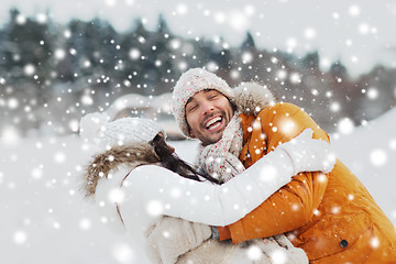 Image showing happy couple hugging and laughing in winter