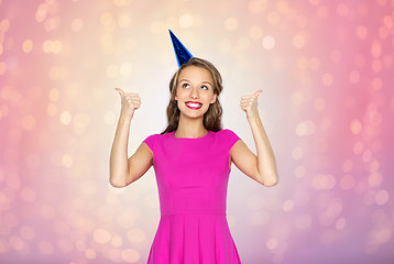 Image showing happy young woman or teen girl in party cap