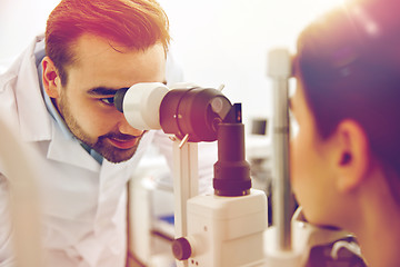 Image showing optician with tonometer and patient at eye clinic