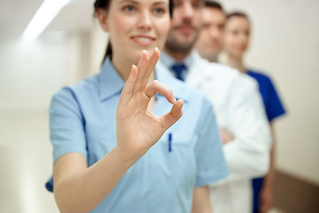 Image showing close up of doctors at hospital showing ok sign