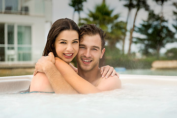 Image showing Young couple in a jacuzzi