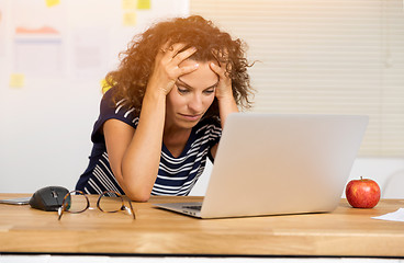 Image showing Exausted woman at the office