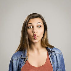 Image showing Woman making pout