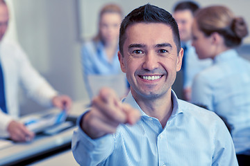 Image showing group of smiling businesspeople meeting in office