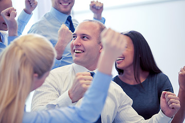 Image showing smiling business people meeting in office