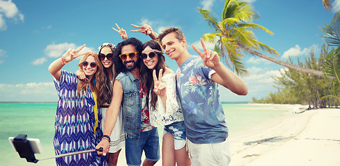 Image showing hippie friends with smartphone on selfie stick