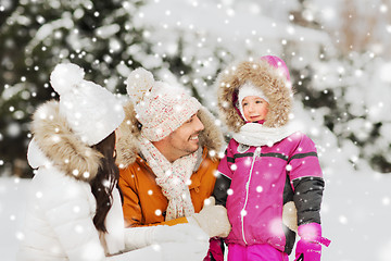 Image showing happy family with child in winter clothes outdoors