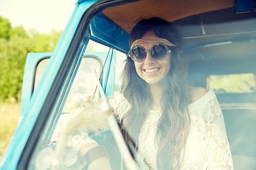 Image showing smiling young hippie woman in minivan car