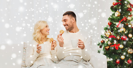 Image showing happy couple at home with christmas tree