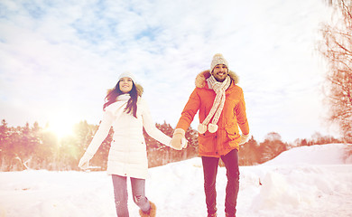 Image showing happy couple running in winter snow