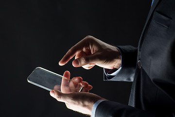 Image showing close up of businessman with glass smartphone