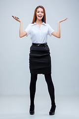 Image showing The young business woman on gray background