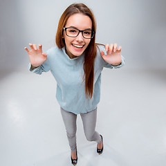 Image showing The smiling young business woman on gray background