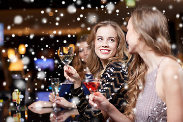 Image showing happy women with drinks at night club