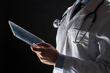 Image showing close up of doctor with tablet pc and stethoscope