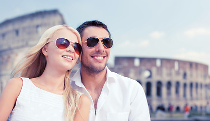 Image showing happy couple hugging over coliseum