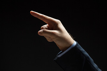 Image showing close up of hand pointing finger to something