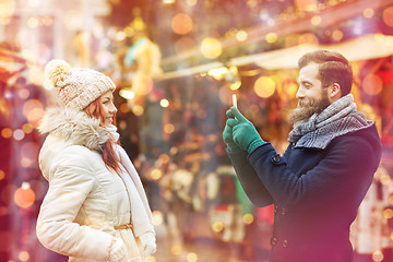 Image showing couple taking selfie with smartphone in old town