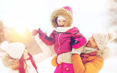 Image showing happy family with child in winter clothes outdoors