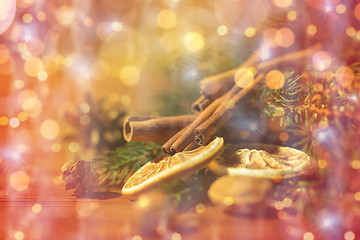 Image showing christmas fir branch, cinnamon and dried orange