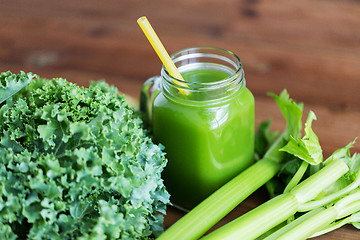 Image showing close up of jug with green juice and vegetables