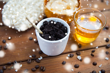 Image showing homemade coffee scrub in cup and honey on wood