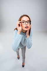 Image showing The young business woman on gray background