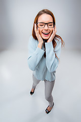 Image showing The smiling young business woman on gray background