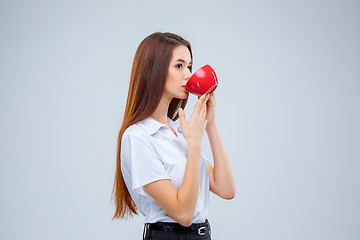 Image showing The young business woman on gray background