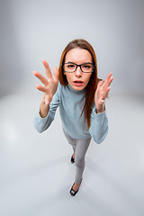 Image showing The young business woman on gray background