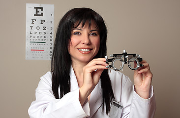 Image showing Eye doctor with trial frames