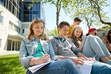 Image showing group of students with notebooks at school yard