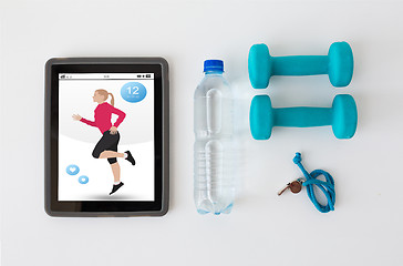 Image showing tablet pc, dumbbells, whistle and water bottle