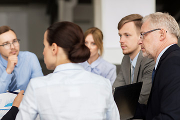 Image showing smiling business people meeting in office