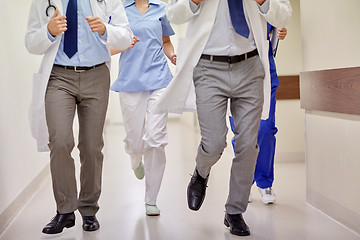 Image showing close up of medics or doctors running at hospital