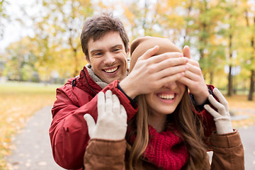 Image showing happy young couple having fun in autumn park